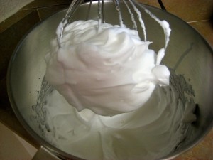 Beat egg whites with sugar till stiff