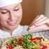 6929405-close-up-of-a-beautiful-female-chef-preparing-a-pizza-in-a-kitchen_tiny